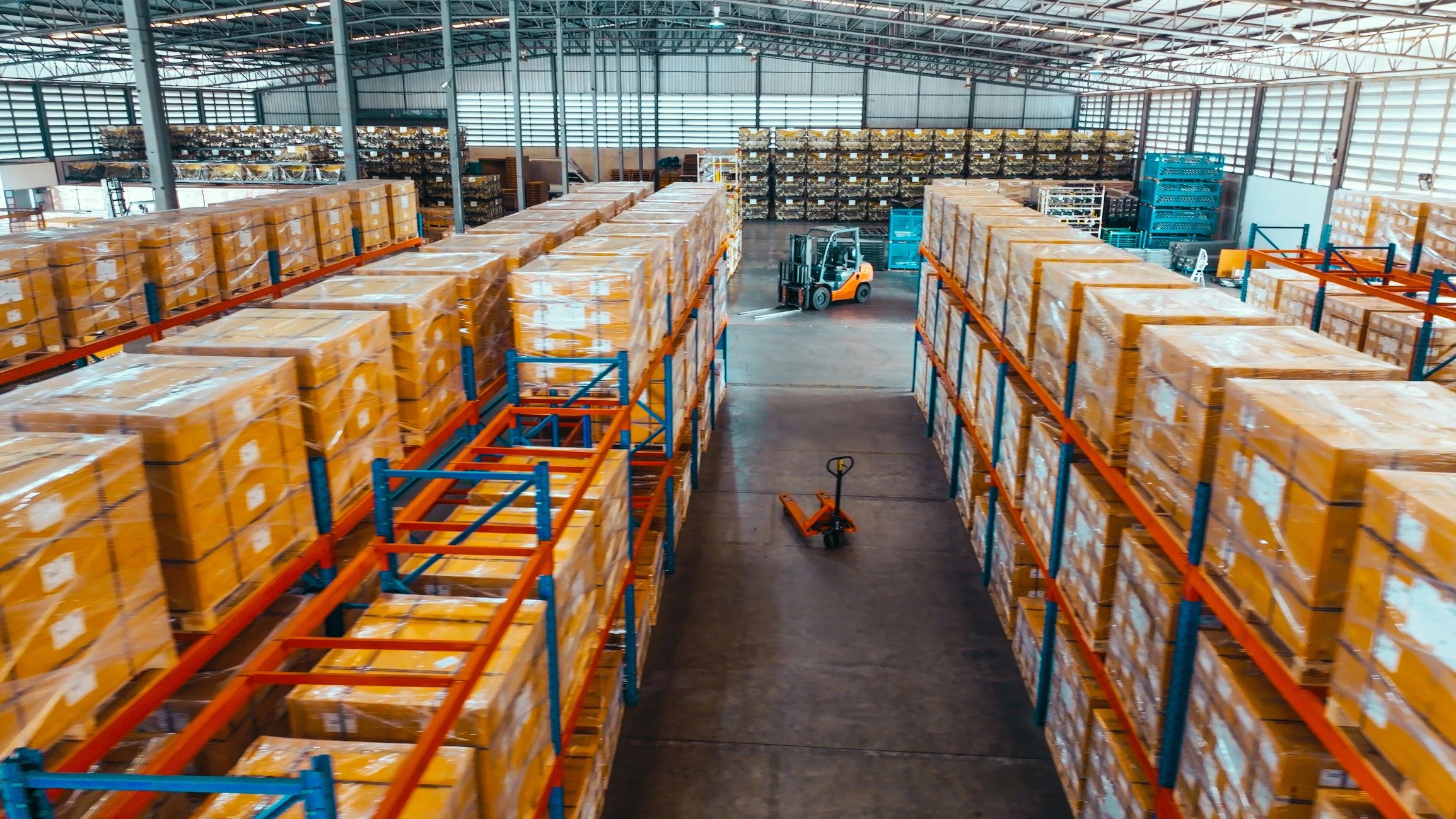 Warehouse shelves and logistics inventory in an industrial facility